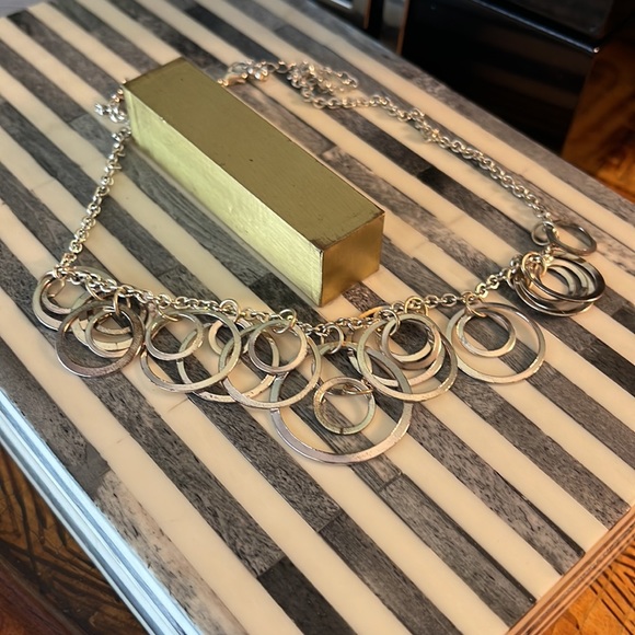 Light silver toned necklace with a variety of circles suspended on silver chain - Picture 11 of 13